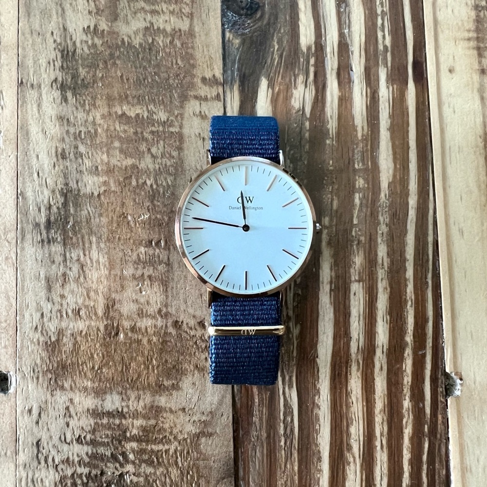 Daniel Wellington gold mens watch with multiple fabric bands